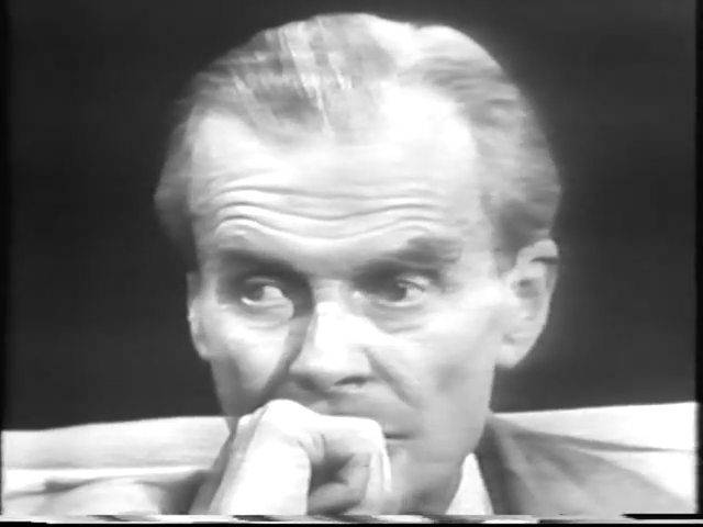 a black and white television frame showing Aldous Huxley, taken from an interview in 1958